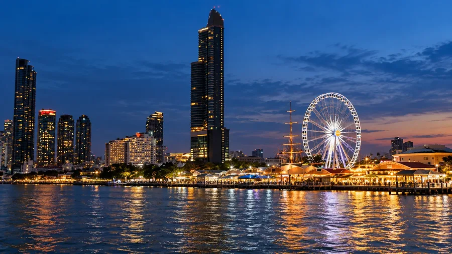 ภาพประกอบ AI ชิงช้าสวรรค์และอาคารริมน้ำเอเชียทีคในช่วงหัวค่ำ